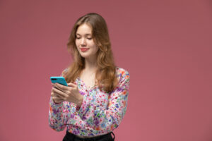 image of a female user using mobile.